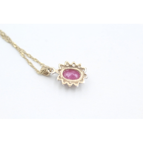 145 - 9ct gold diamond and ruby set cluster pendant necklace (1.9g)