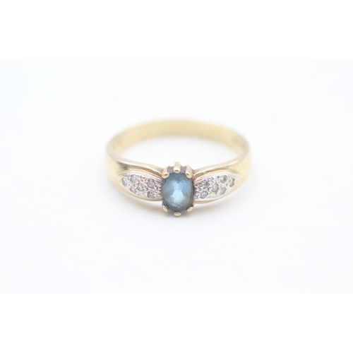 149 - 9ct gold diamond and blue topaz dress ring (2.6g) Size  Q