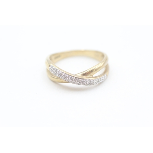 155 - 9ct gold pave set diamond crossover ring (3.4g) Size  Q