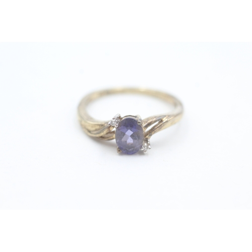 163 - 9ct gold diamond accented iolite set ring (2g) Size  N