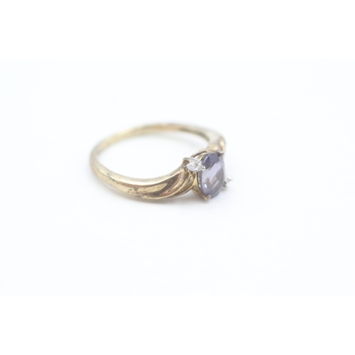 163 - 9ct gold diamond accented iolite set ring (2g) Size  N