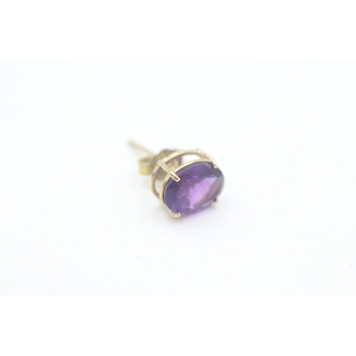 167 - 9ct gold oval cut amethyst set stud earrings (1.9g)