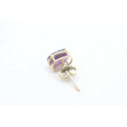 167 - 9ct gold oval cut amethyst set stud earrings (1.9g)