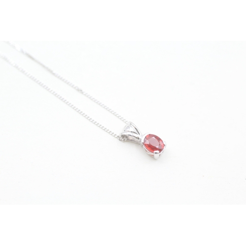 169 - 9ct white gold ruby set pendant necklace (1.3g)