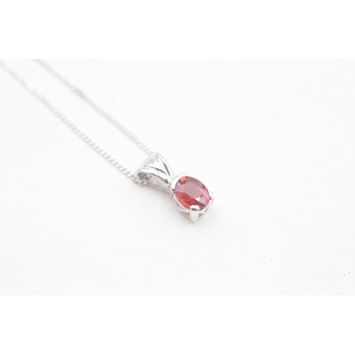 169 - 9ct white gold ruby set pendant necklace (1.3g)