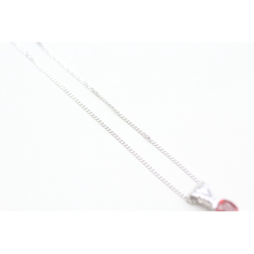 169 - 9ct white gold ruby set pendant necklace (1.3g)