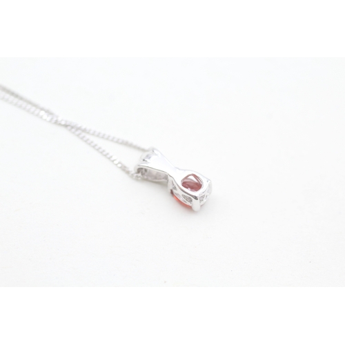 169 - 9ct white gold ruby set pendant necklace (1.3g)