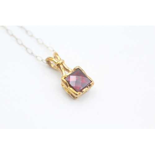 176 - 9ct gold chequer cut garnet set solitaire pendant necklace (1.9g)