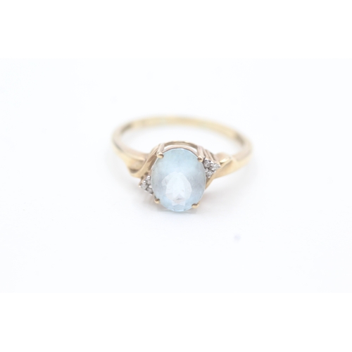 180 - 9ct gold aquamarine single stone ring with diamond accents (2.5g) Size  T