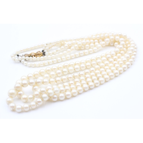 190 - 9ct gold cultured pearl three strand necklace (42.6g)