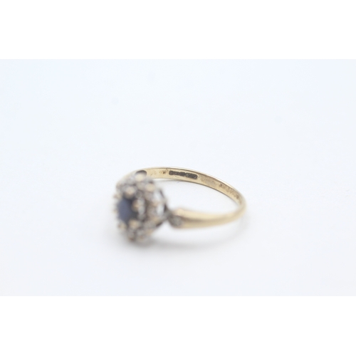 194 - 9ct gold diamond & sapphire oval halo ring (1.5g) Size  H