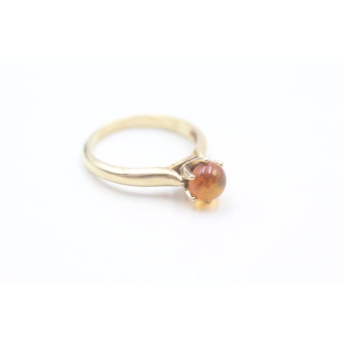 196 - 9ct gold claw set baltic amber cabochon solitaire ring (2.9g) Size  N