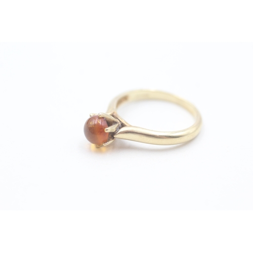 196 - 9ct gold claw set baltic amber cabochon solitaire ring (2.9g) Size  N