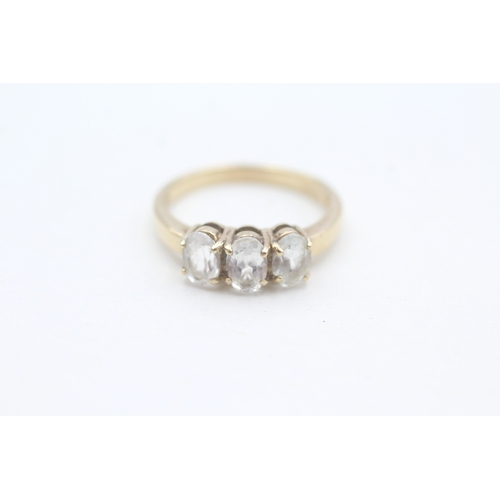 20 - 9ct gold oval cut white topaz set trilogy ring (2.6g) Size  O