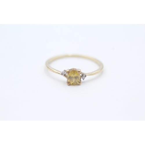 204 - 9ct gold delicate yellow gemstone and diamond set ring (0.8g) Size  M