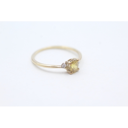 204 - 9ct gold delicate yellow gemstone and diamond set ring (0.8g) Size  M