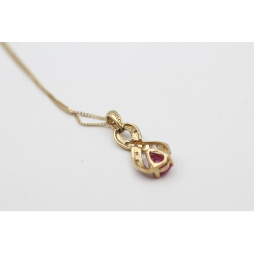 220 - 9ct gold diamond & ruby pendant necklace (1.6g)