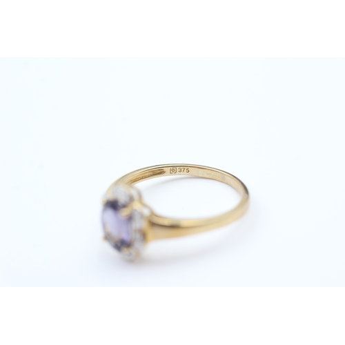 221 - 9ct gold amethyst single stone ring with diamond frame (2.3g) Size  P