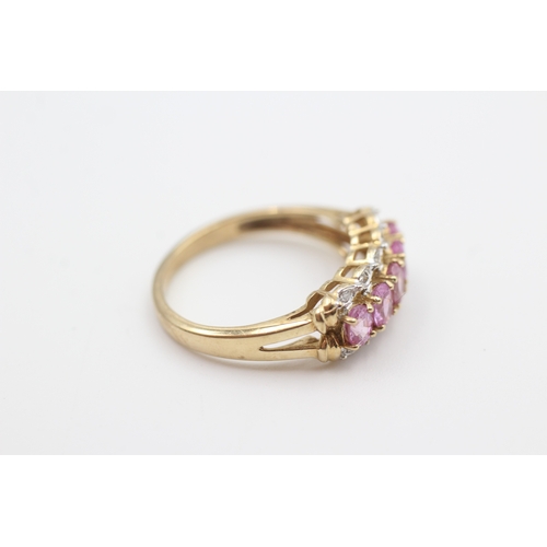 249 - 9ct gold pink sapphire five stone ring with diamond surround (2.6g) Size  N