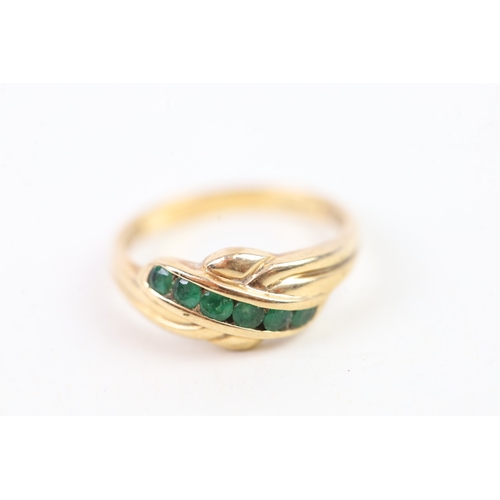 33 - 9ct gold channel set emerald knot ring (2.5g) Size  O