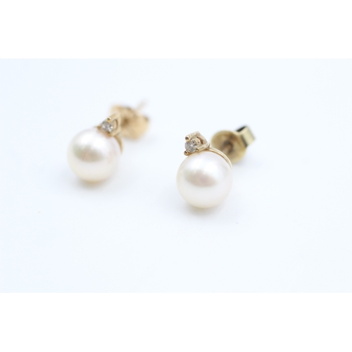 44 - 9ct gold diamond and cultured pearl set stud earrings (2g)