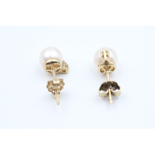 44 - 9ct gold diamond and cultured pearl set stud earrings (2g)