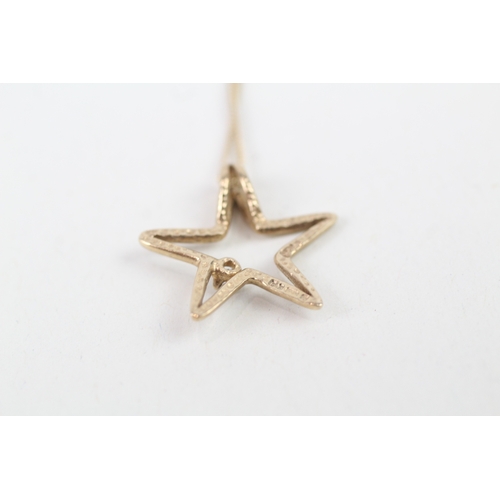 46 - 9ct gold diamond set cut out star pendant necklace (1.9g)