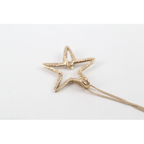 46 - 9ct gold diamond set cut out star pendant necklace (1.9g)