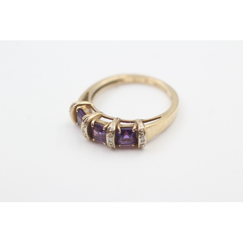 48 - 9ct gold amethyst three stone ring with diamond spacers (2.8g) Size  M