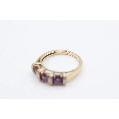 48 - 9ct gold amethyst three stone ring with diamond spacers (2.8g) Size  M