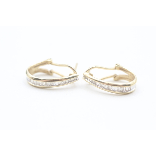 56 - 14ct gold baguette cut diamond set hoop earrings (3.6g)