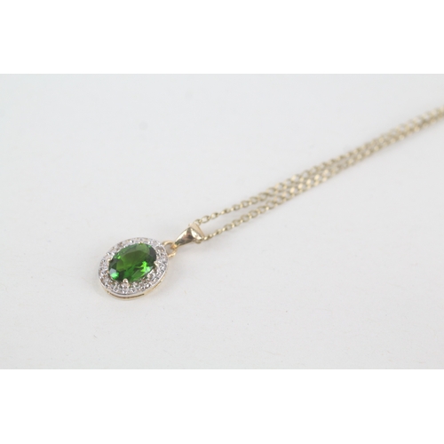 57 - 9ct gold diamond & diopside oval halo pendant necklace (2.1g)