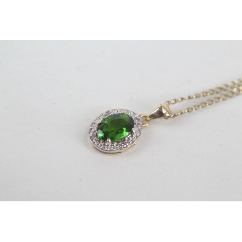 57 - 9ct gold diamond & diopside oval halo pendant necklace (2.1g)