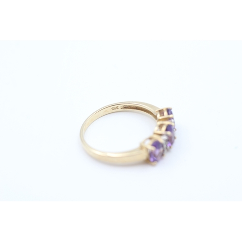 6 - 9ct gold amethyst three stone ring with diamond spacers (2.4g) Size  P