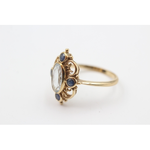 63 - 9ct gold sapphire & topaz dress ring (3g) Size  N