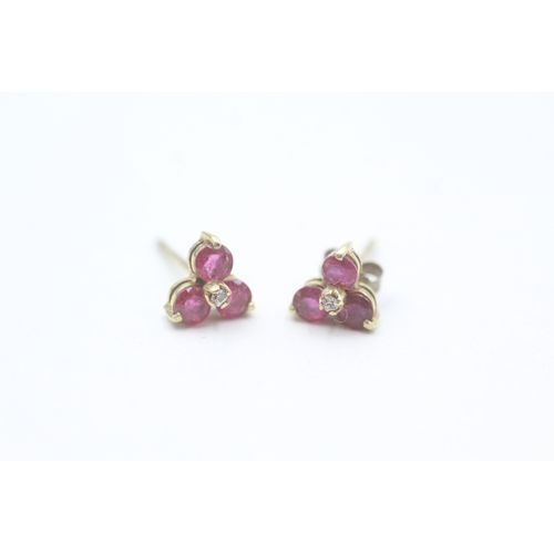 67 - 9ct gold ruby and diamond set floral stud earrings (1.3g)