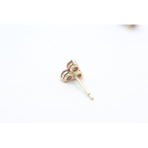 67 - 9ct gold ruby and diamond set floral stud earrings (1.3g)