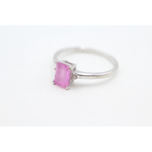 80 - 9ct white gold diamond accented pink gemstone set dress ring (2.1g) Size  R