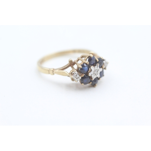 82 - 9ct gold diamond and sapphire set cluster ring (2.6g) Size  M