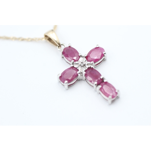 87 - 9ct gold diamond and ruby set cross pendant necklace (3.5g)