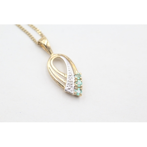 98 - 9ct gold diamond and emerald set ribbon pendant necklace (2.4g)