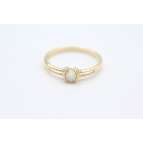 99 - 18ct gold tension set cabochon opal solitaire ring (1.9g) Size  O