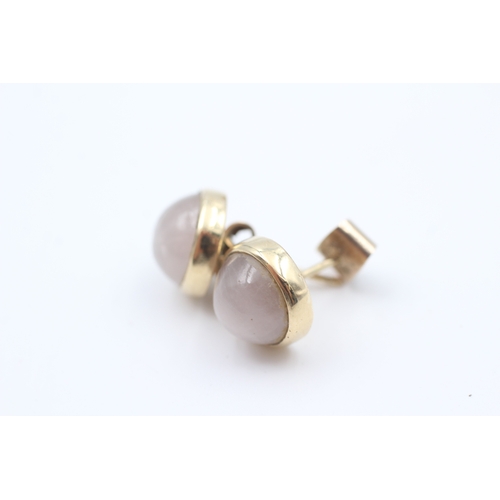 103 - 9ct gold rub over set rose quartz cabochon stud earrings (3g)