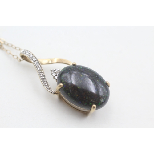 123 - 9ct gold diamond accented black opal cabochon set pendant necklace (2g)