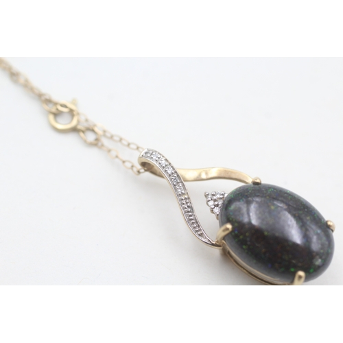 123 - 9ct gold diamond accented black opal cabochon set pendant necklace (2g)