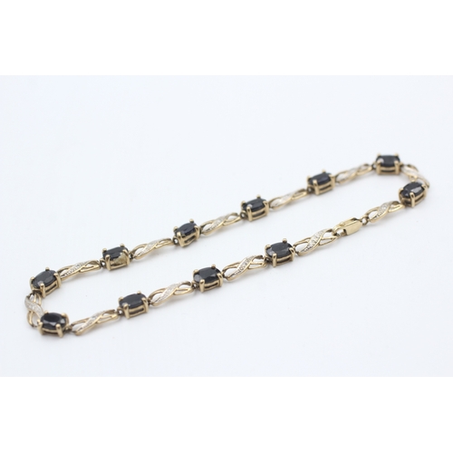 23 - 9ct gold diamond & sapphire fancy link bracelet (6.3g)