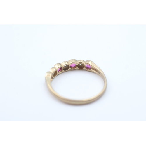 27 - 9ct gold ruby and diamond set seven stone eternity ring (1.7g) Size  O