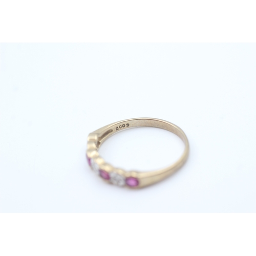 27 - 9ct gold ruby and diamond set seven stone eternity ring (1.7g) Size  O