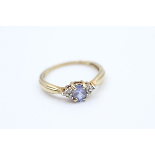 33 - 9ct gold diamond accented oval cut tanzanite dress ring (1.8g) Size  P