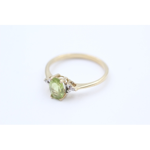 40 - 9ct gold diamond accented oval cut peridot set dress ring (1.7g) Size  Q